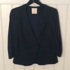 . Lazer cut lapels. Shirred sleeves. Lined. Navy.